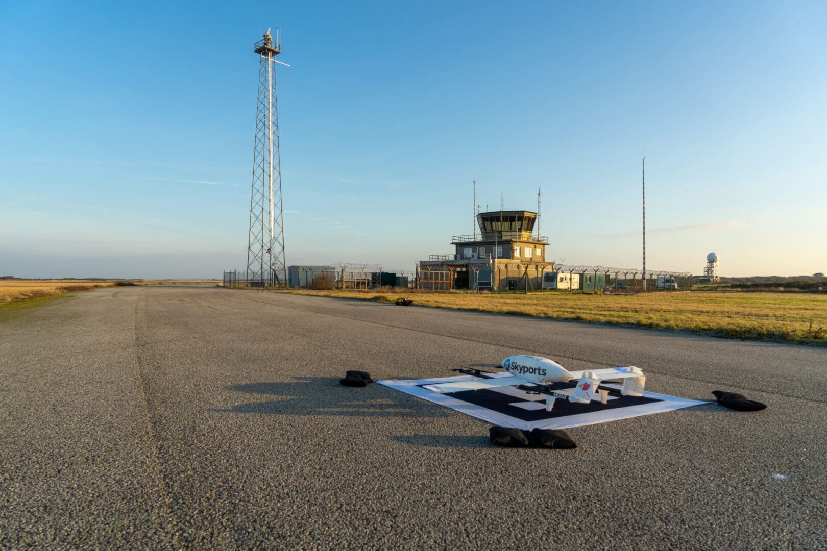 A small plane sitting on top of an airport runway.