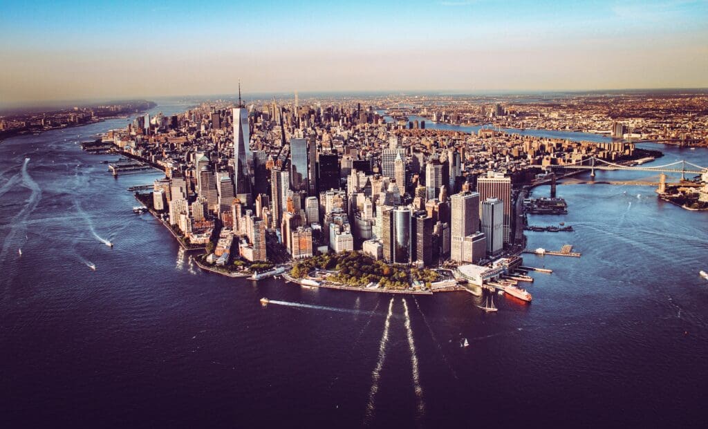 Aerial view of manhattan island, new york city, with the hudson and east rivers during the day.